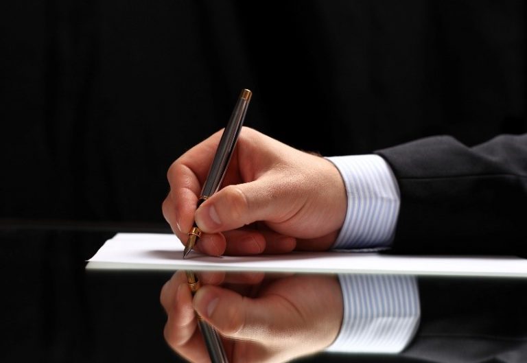 writing man's hand shown writing