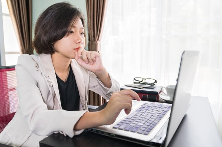 first-impressions-count woman sitting in front of window and looking at computer